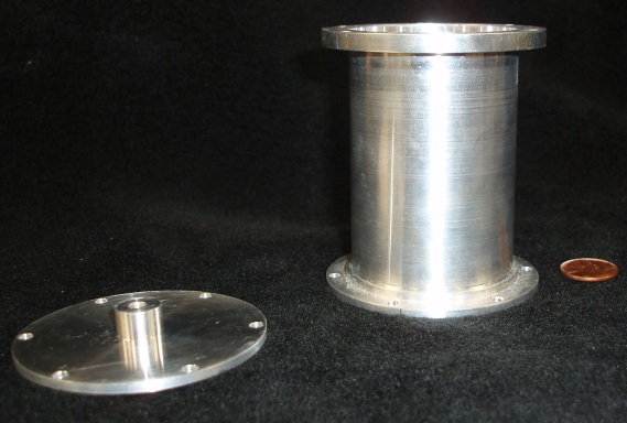 Side view of an aluminum sample can for single crystal with its lid.