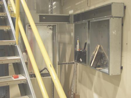 AND/R's three electrical power breaker panels installed behind the stairs